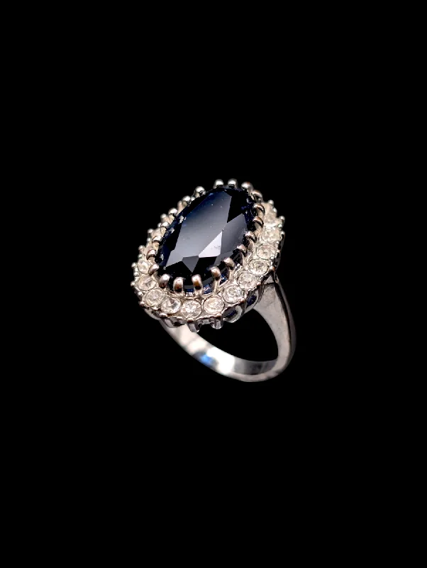 Rings with faceted garnet for deep shine -Vintage Simulated Royal Blue Sapphire and Diamond Halo Silver Toned Costume Ring