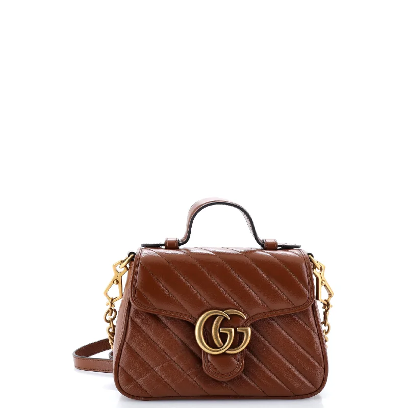 Handle bags with suede accents for texture -GG Marmont Top Handle Flap Bag Matelasse Leather Mini